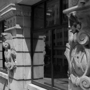 Black and white image of building exterior pillars