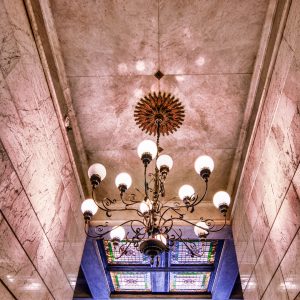 Stone walls and chandelier in lobby